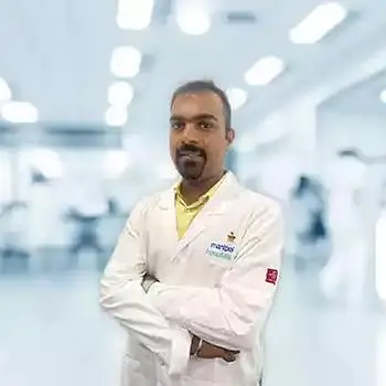 Dr. Kiran B