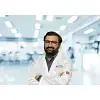Dr. Harish E